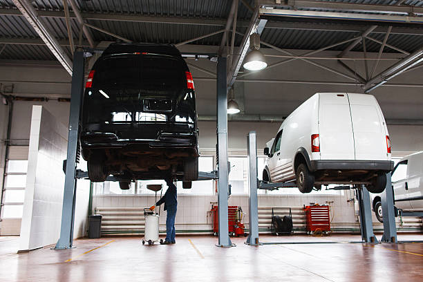 Auto service maintenance for minibuses, workshop Auto service maintenance for minibuses, modern workshop for car repairing cycle vehicle stock pictures, royalty-free photos & images