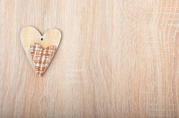 istock Heart on wooden background 576746174