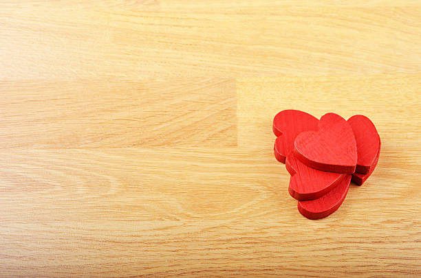 istock Heart on wooden background 576746212