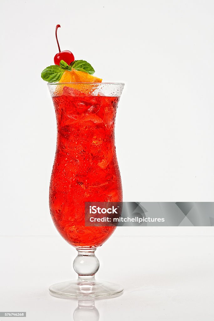 Citrus Hurricane Cocktail Citrus Hurricane Cocktail on a white background. orange cherry mint garnish Alcohol - Drink Stock Photo