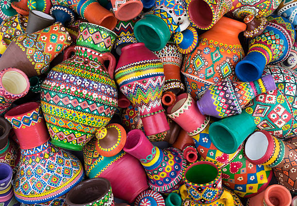 istock Pile of artistic painted handcrafted pottery jars 576746416