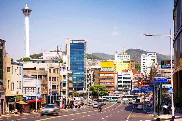 Busan South Korea Taejong-ro daytime view with Busan tower to the left. Traffic is blurred.