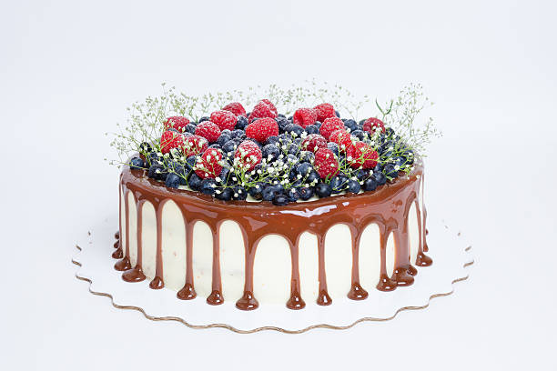 istock color drip cake with blueberries and raspberries 576750210