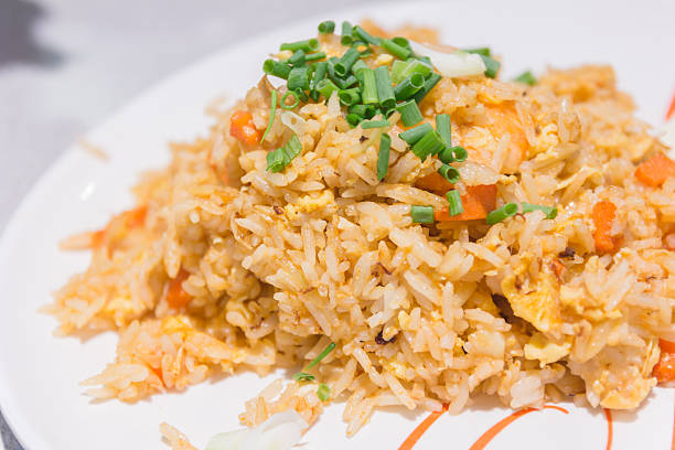 istock Homemade Chinese fried rice with vegetables, chicken and fried e 576751468