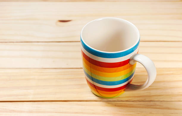 istock Cup colorful on wooden table 576751728