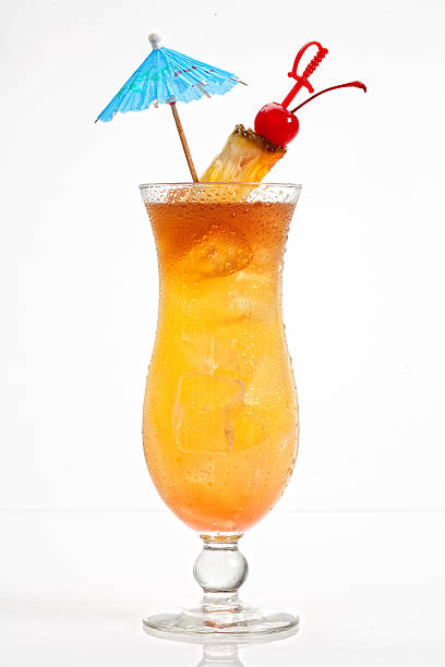 Mai Tai Mai Tai cocktail on white background, pineapple, cherry garnish and umbrella mai tai stock pictures, royalty-free photos & images