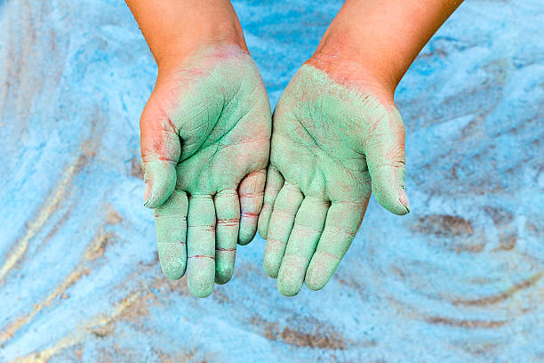 istock Child showing green hands with chalk 576753818