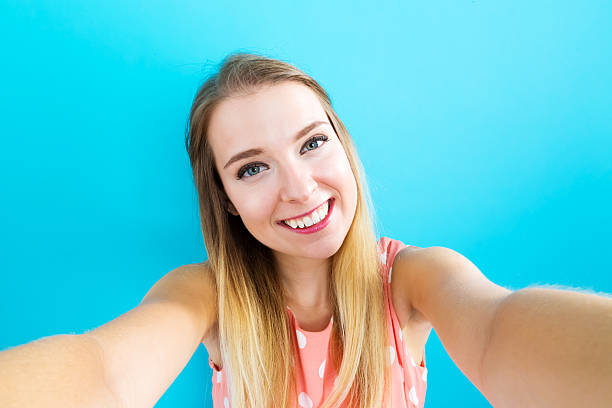 istock Young woman taking a selfie 576755510