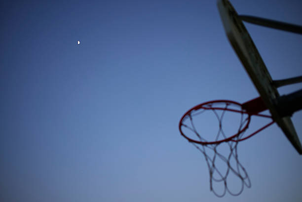 istock Moon in Evening Sky With Basketball Hoop 576755622