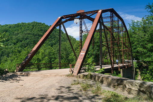 View of 1912 historic metal truss Jenkinsburg Bridge near Mt Nebo and Morgantown over Cheat River