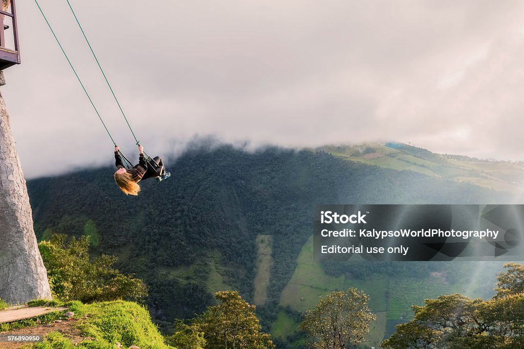 Silhouette Of Young Happy Blonde Woman On A Swing Banos De Agua Santa, Ecuador - 30 March 2015: Silhouette Of Young Happy Blonde Woman On A Swing, Casa Del Arbol, The Tree House, Ecuador  Activity Stock Photo