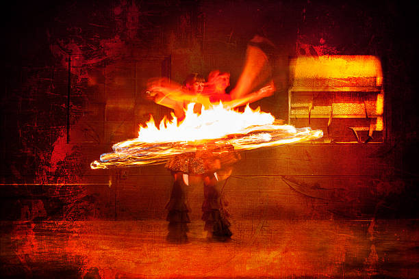 istock Beautiful Woman Spinning Fire and Dancing 576893456