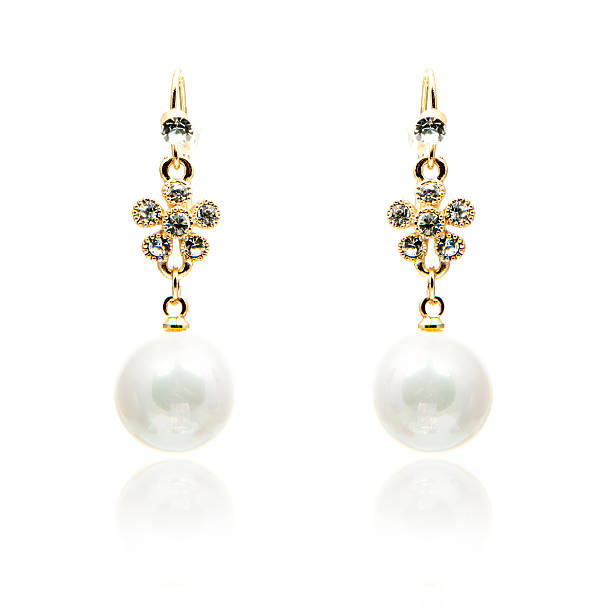 istock Pair of natural pearls earrings isolated on white 576894732