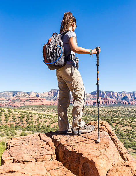 istock Woman Hiking Reaches Viewpoint 576897486