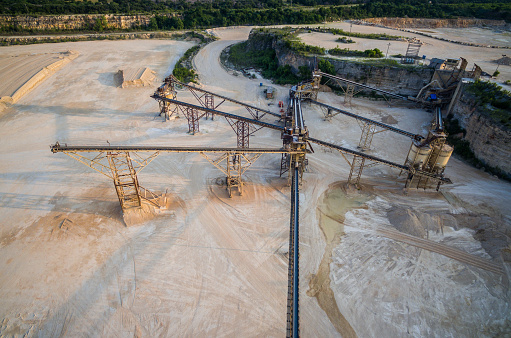 industrial Open Pit Mine Central Texas with amazing perspective over conveyor belt system from a limestone extraction factory otuside of Austin / Round Rock , Texas 