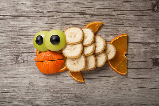 istock Fish made of orange and banana 576902436