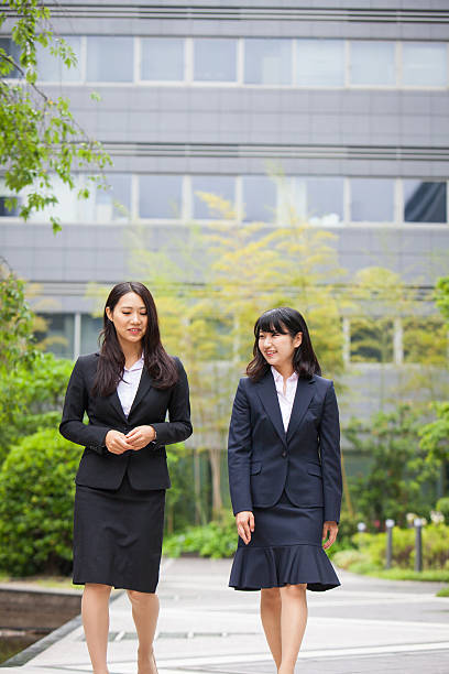 istock Two corporate women having a walk 576905330