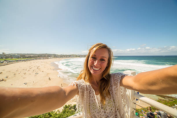 istock Girl takes selfie at Bondi beach 576908164