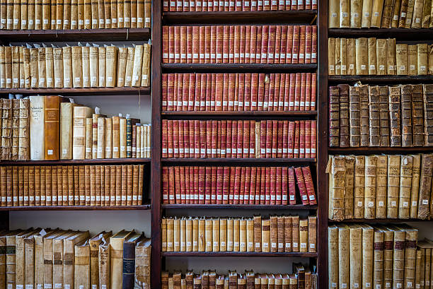 istock Old books on wooden shelves 576908564