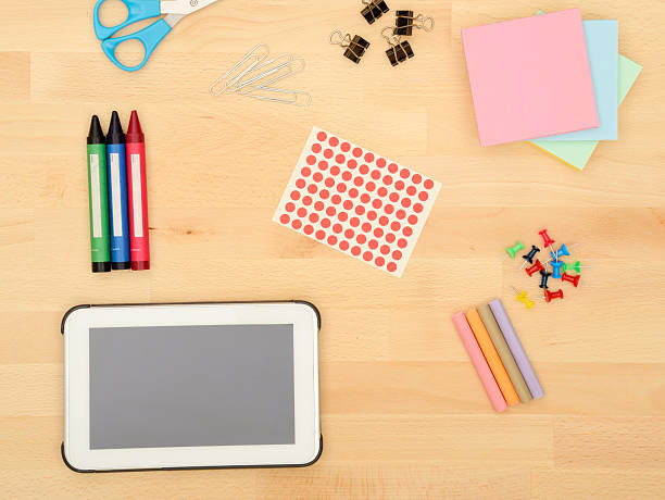 istock Office Supplies on a wooden desk 576909716