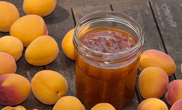 istock Apricots and pot of jam 576910106