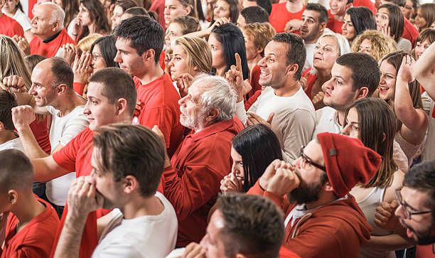 istock Large group of mixed age sport fans cheering. 576910330