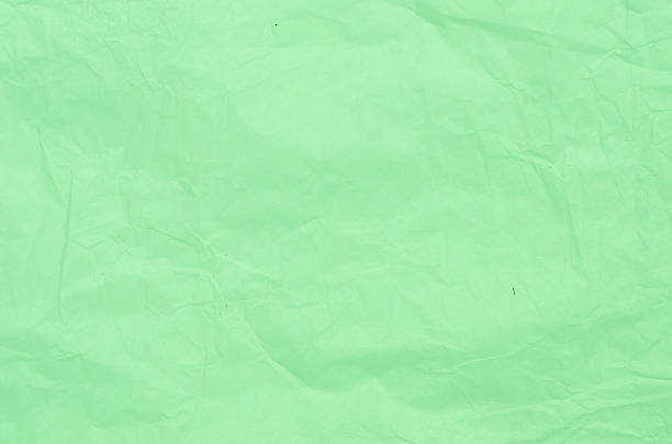istock crumpled green paper tissue  background 576910996