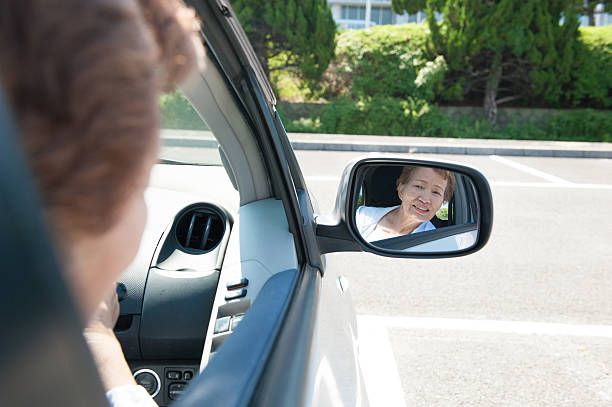 istock Elderly woman driving a car 576913512