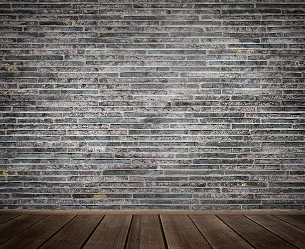 istock Old brick wall and wood floor background. 576913852