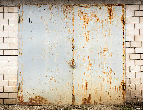 istock old metal warehouse door 576915336