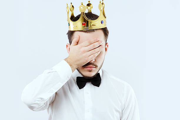 istock Young man close his face by his hand in studio 576915736