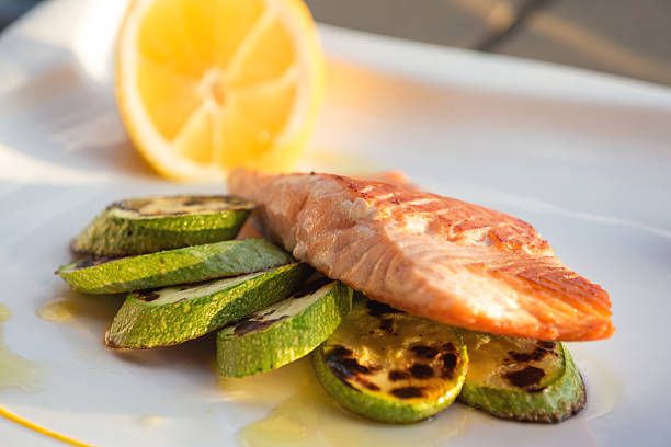 Grilled salmon served with zucchini
