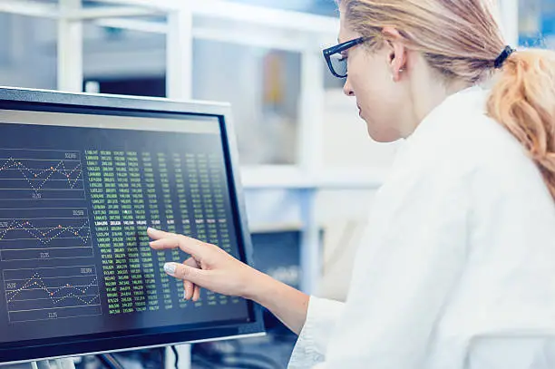 Photo of Scientist Interacting With The Computer Via Touch Screen