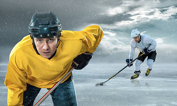 istock Ice hockey player on the ice in mountains 576919938
