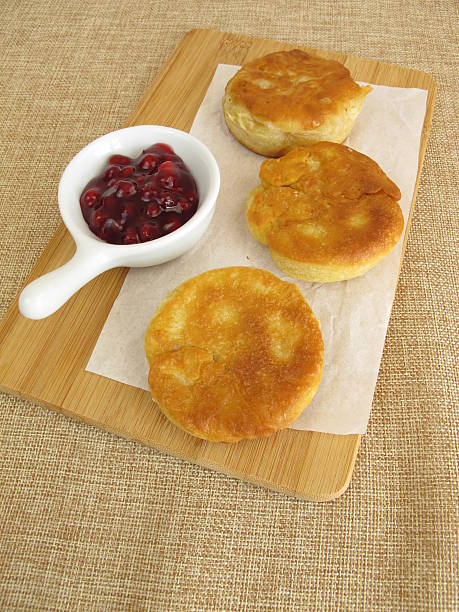 istock Small crumpets pancakes with cranberry jam 576920904
