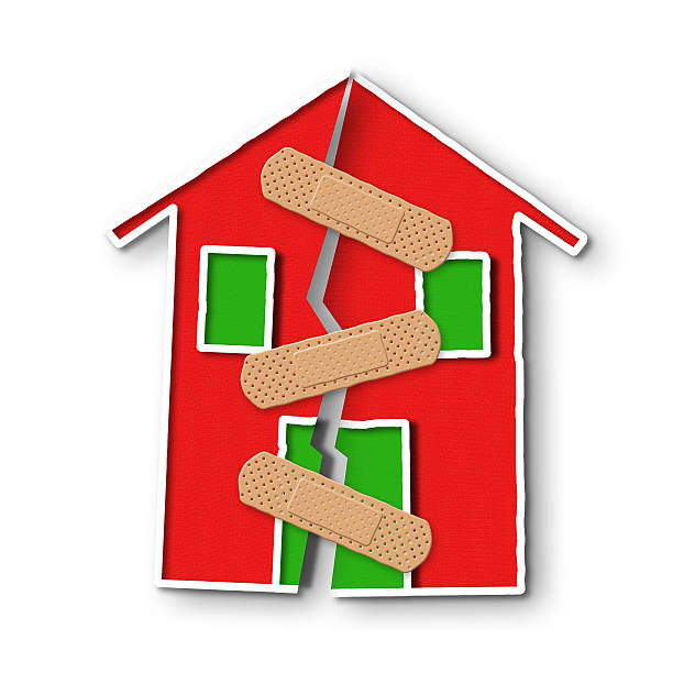 istock Small house with a deep crack in the wall 576921870