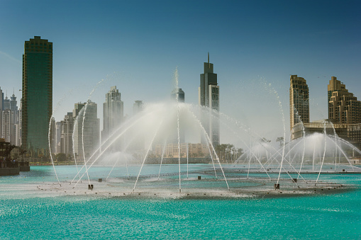 DUBAI, UAE - NOVEMBER 14: High rise buildings and fountains nov 14. 2012  in Dubai, UAE.  Burj Khalifa, the tallest building in the world