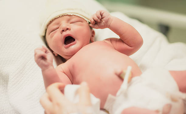 Newborn Yarning A newborn baby yarning. home birth photos stock pictures, royalty-free photos & images