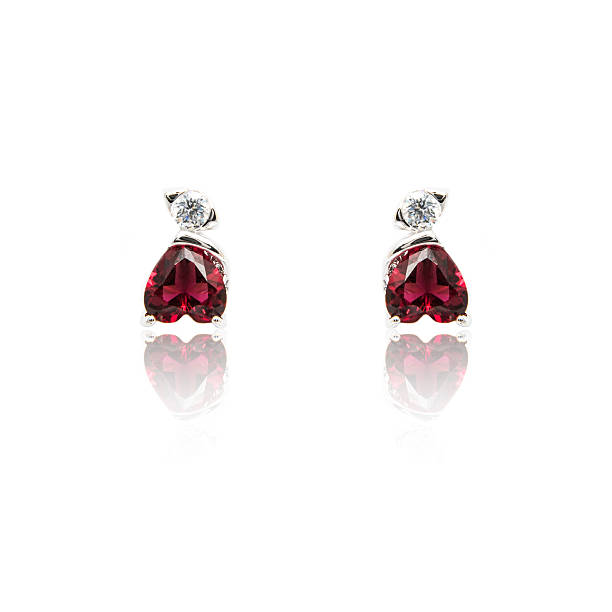 istock Pair of ruby diamond earrings isolated on white 576924186