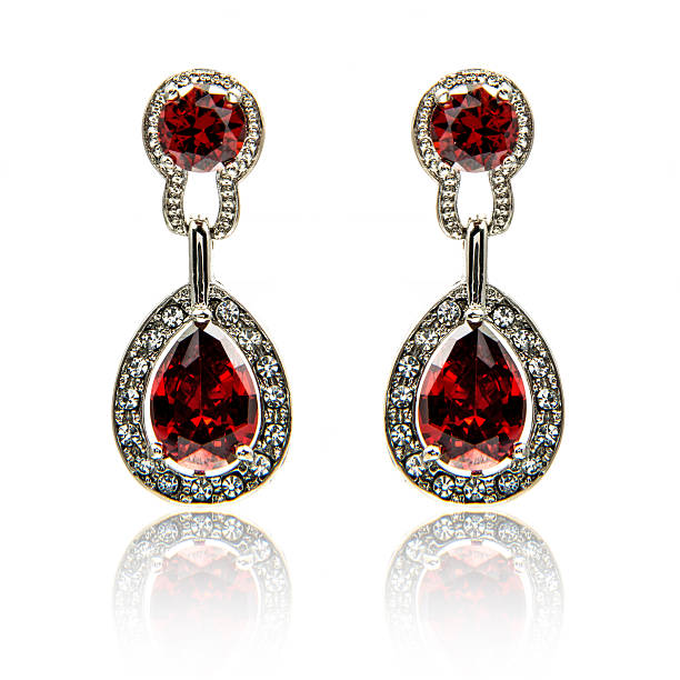 istock Pair of ruby diamond earrings isolated on white 576924642