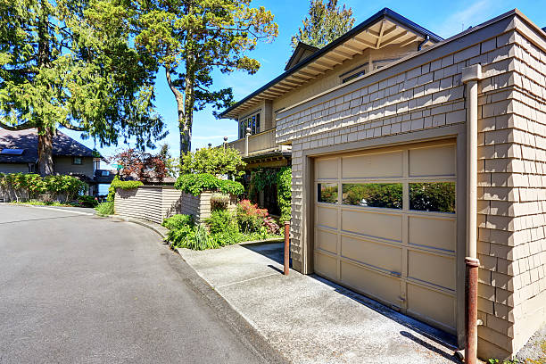 istock Garage space of large beige house . 576925222