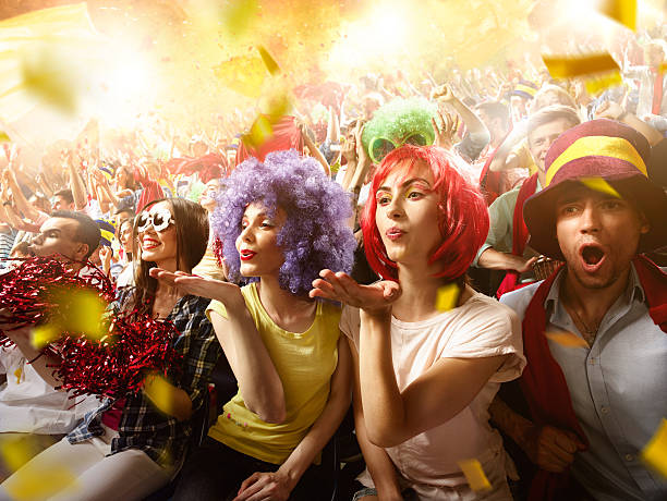 istock Sport fans: Two female friends send a kiss 576925554