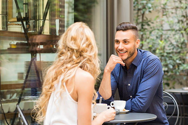 istock Beautiful couple having coffee on a date 576926032