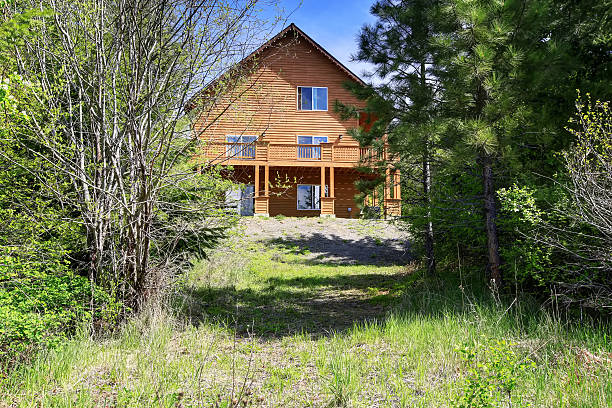istock Large Cabin style home in the woods 576926872