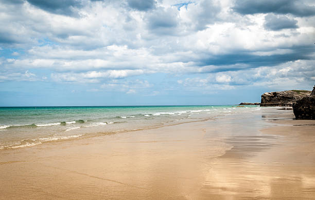 istock Tropical sandy beach with clear sky at the low tide. 576928228