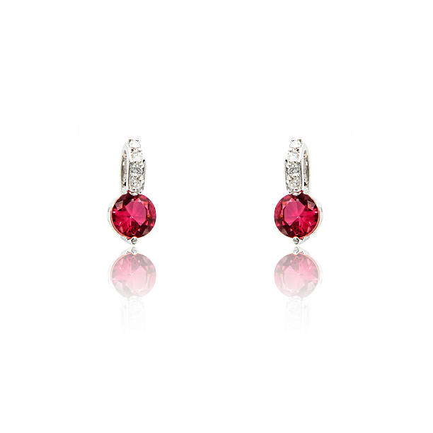 istock Pair of ruby diamond earrings isolated on white 576928658