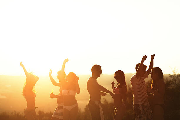 istock Friends partying during summer vacation 576929674