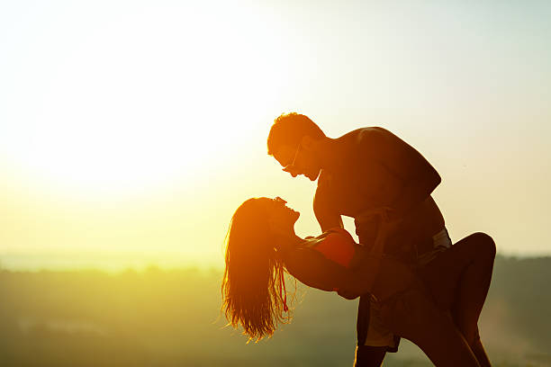 istock Romantic dance at sunset by couple 576929722