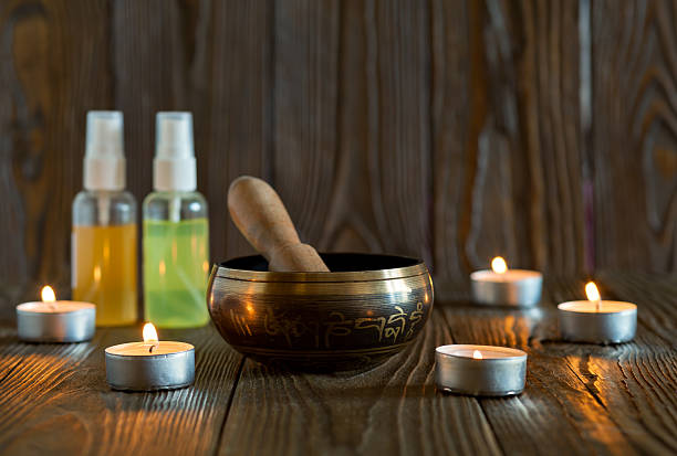 istock singing bowl on dark wooden background. 576930018