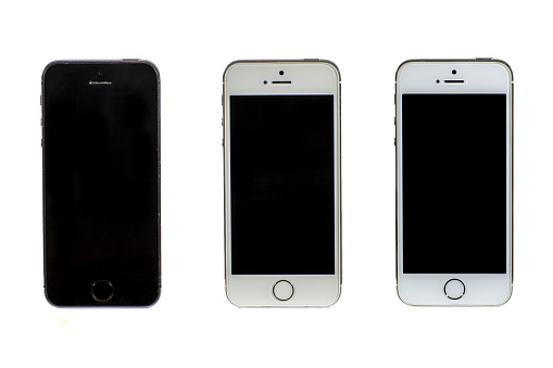 Plovdiv, Bulgaria - June 16, 2016: Frontal view of an used three Iphone 5S mobile phones isolated on a white background